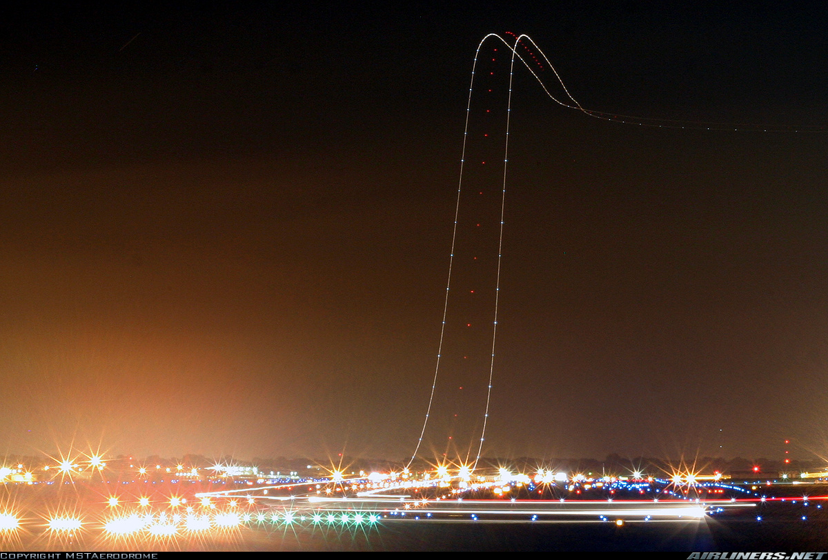 long exposure plane taking off at night